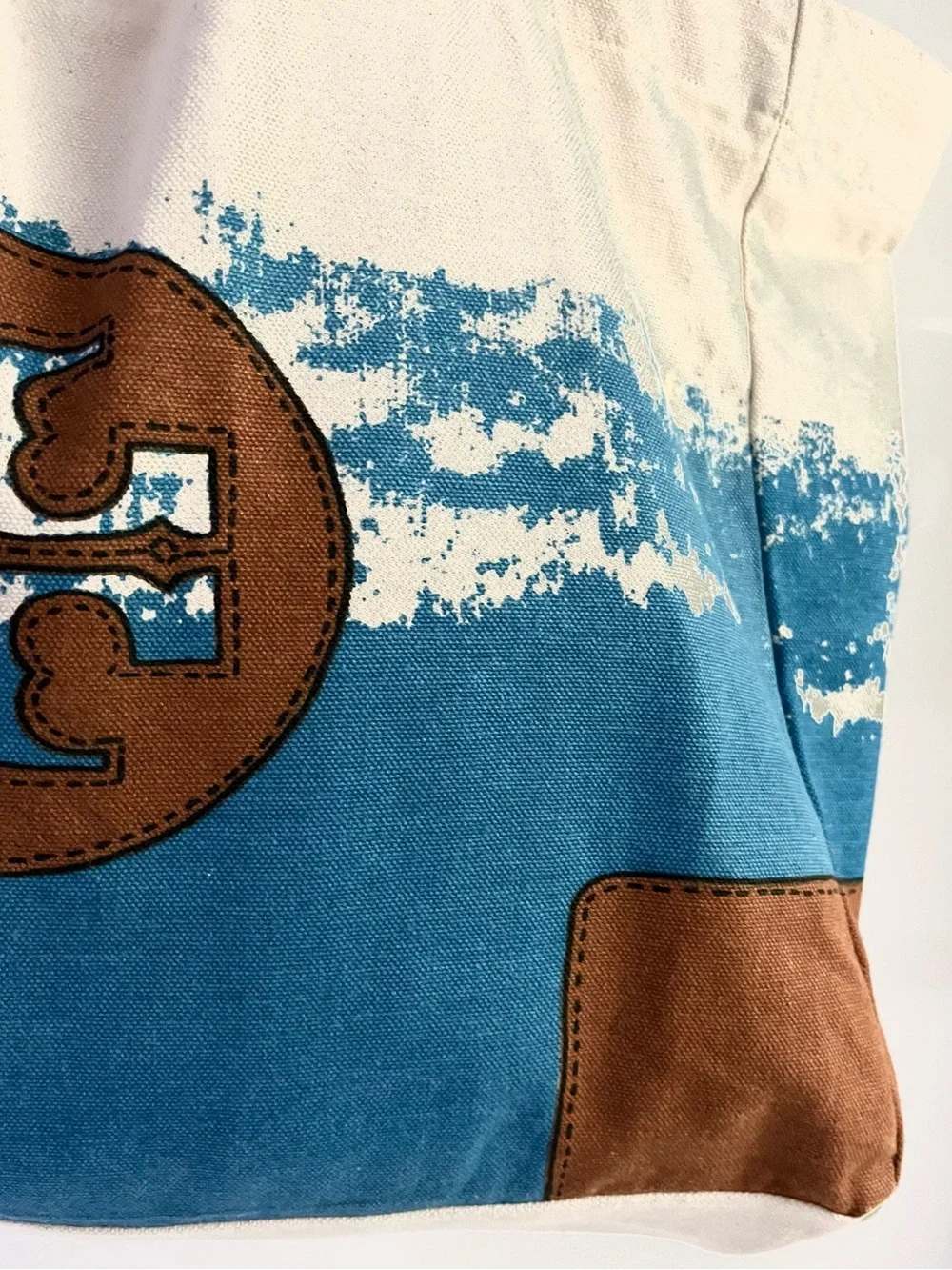 Tory Burch features cream